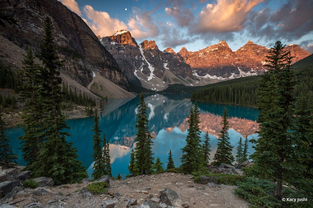 Today’s Photo Of The Day is “Peaks Aglow” by Kacy Joshi. Location: Banff National Park in Alberta, Canada.