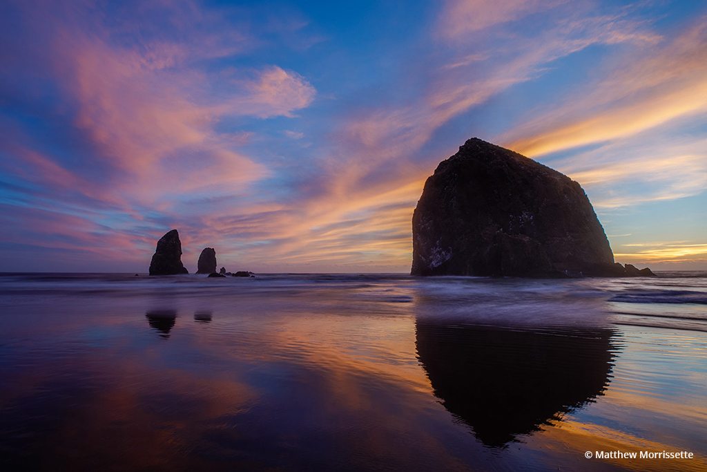 Today’s Photo Of The Day is “Sunset Reflections of Haystack Rock” by Matthew Morrissette. Location: Cannon Beach, Oregon. 