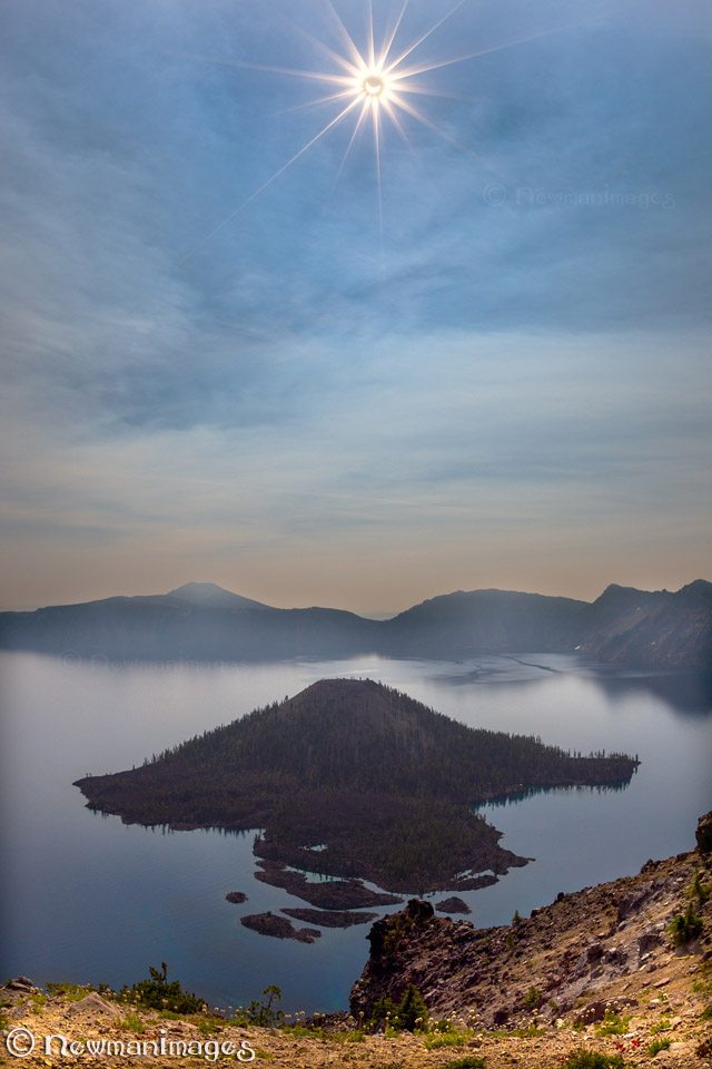 Today’s Photo Of The Day is “Eclipse Over Wizard Island” by NewmanImages. Location: Crater Lake National Park, Oregon.