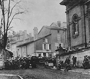 Soldiers of the 353rd Infantry near a church at Stenay, Meuse in France.
