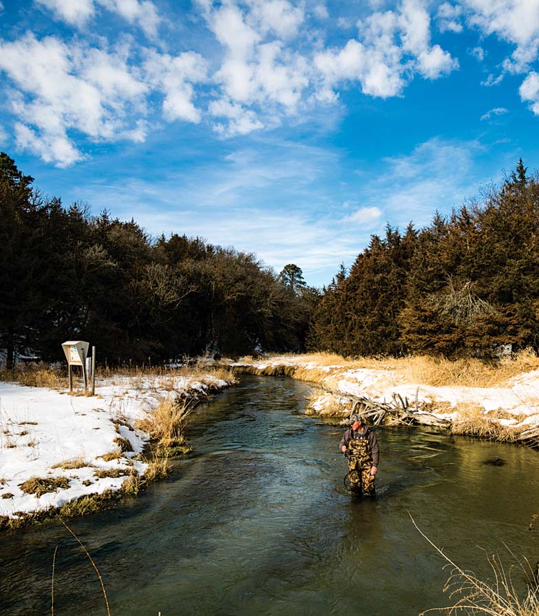 : Rick Wheatley fishes for trout in Long Pine Creek at Long Pine SRA in Brown County during the winter. Coolwater streams are also on the Aquatic Habitat Program’s plan to improve fish habitat and angler access.
