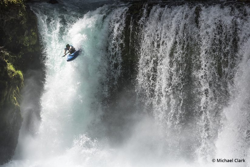 Adventure sports photography, kayaking over falls